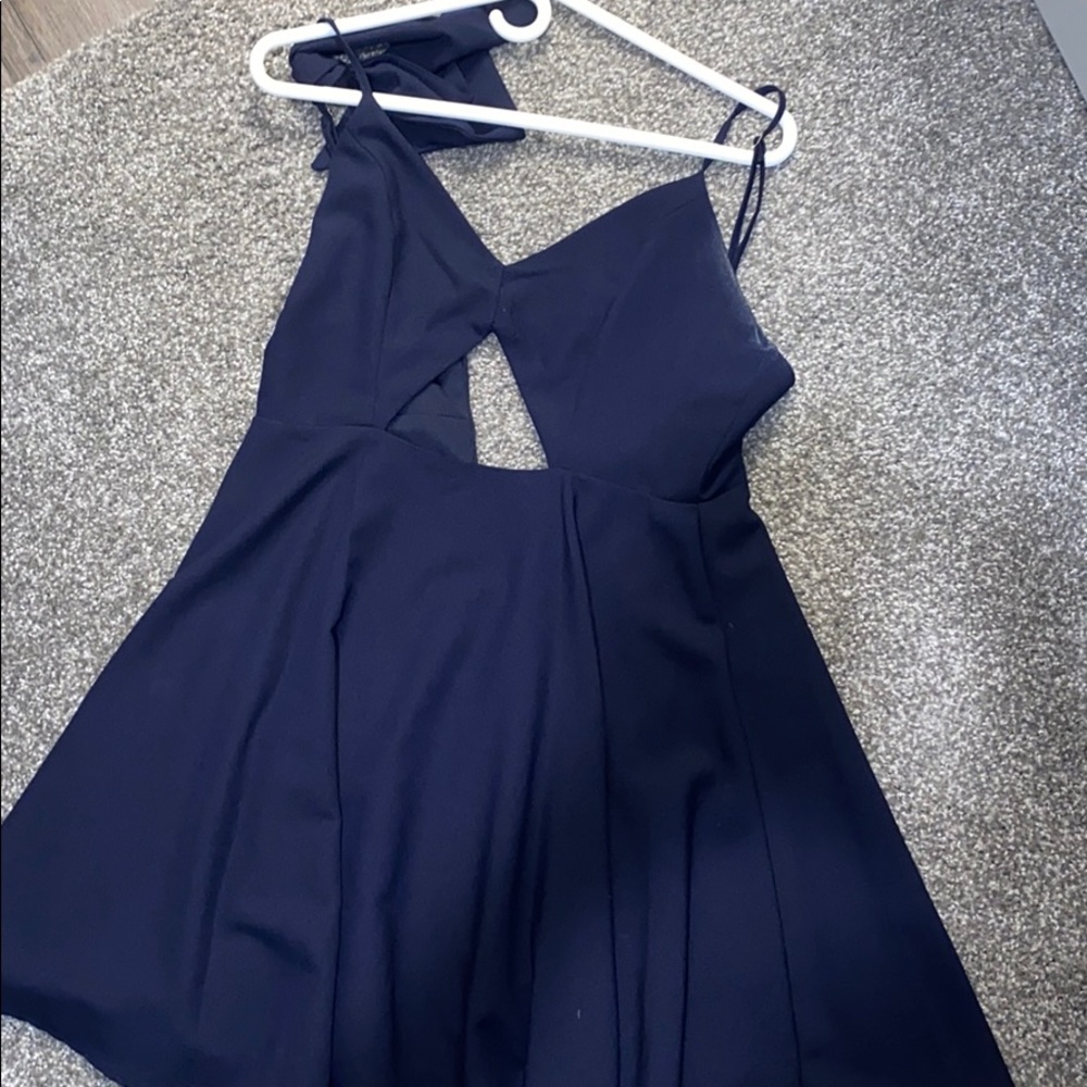 Blue romper. Cut out in front. Comes with a knot